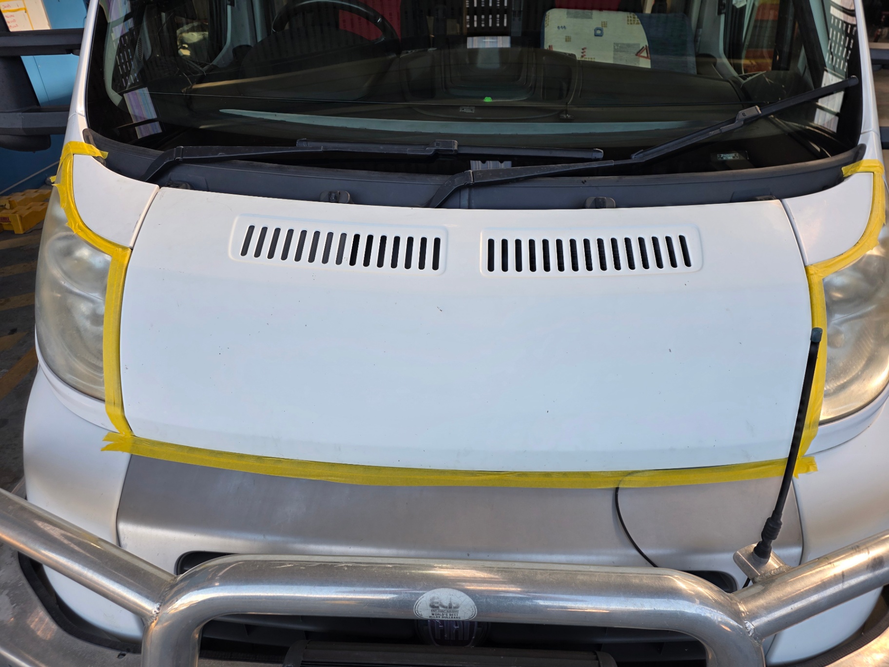 Motorhome bonnet masked up for paint correction