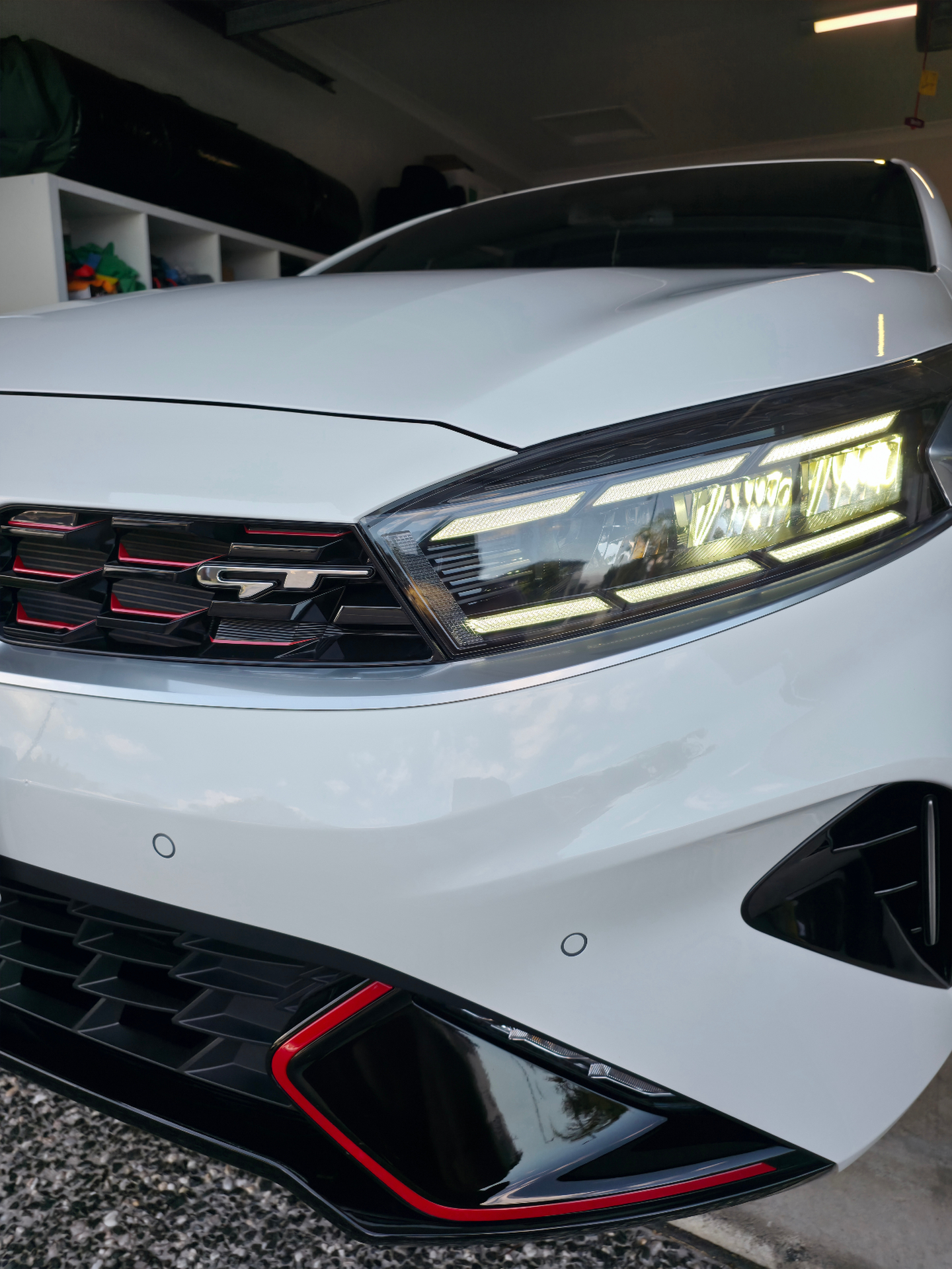 Kia GT front headlight detail — Pitts Automotive Studio