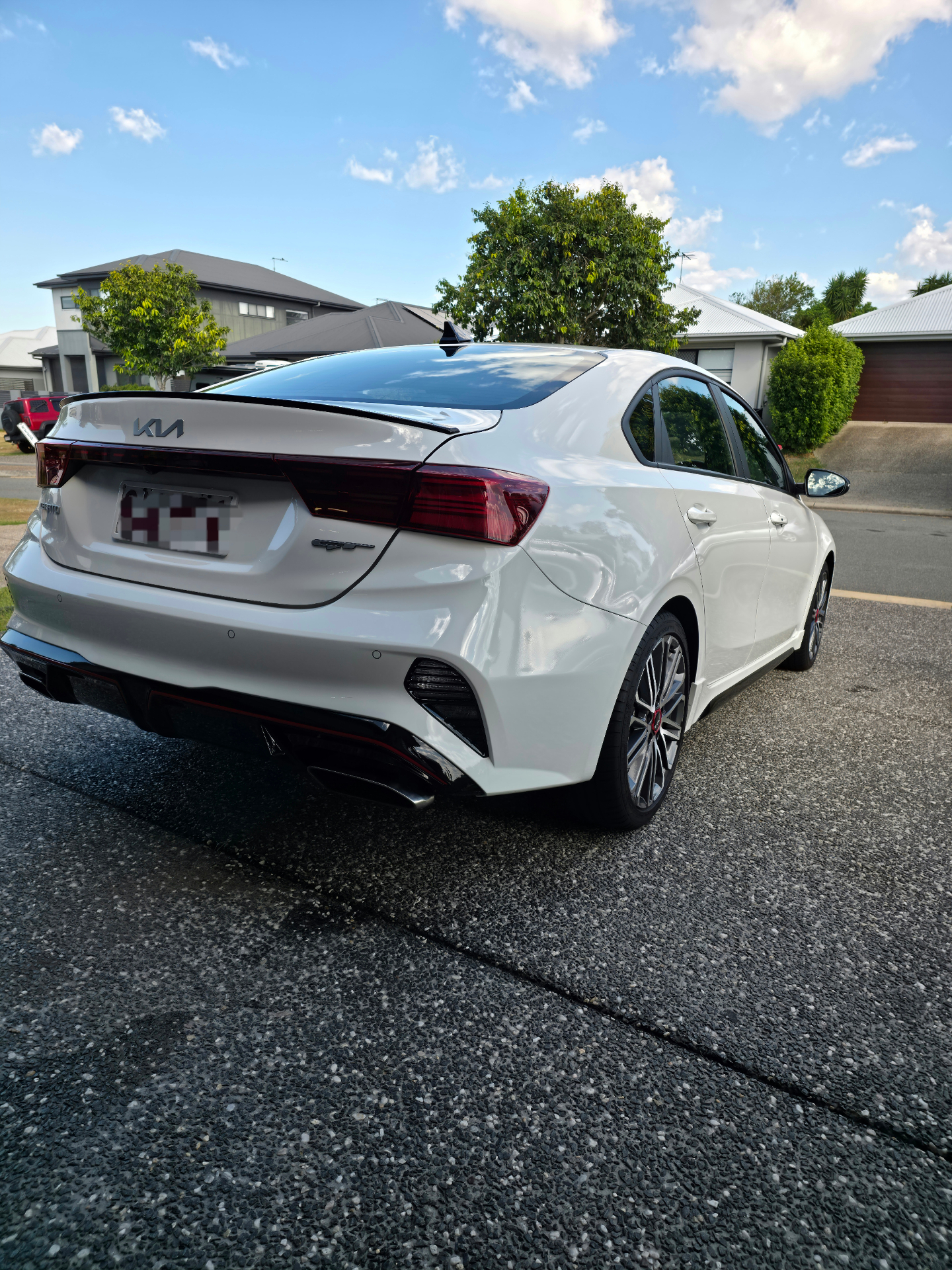 White Kia GT rear after detail — Pitts Automotive Studio